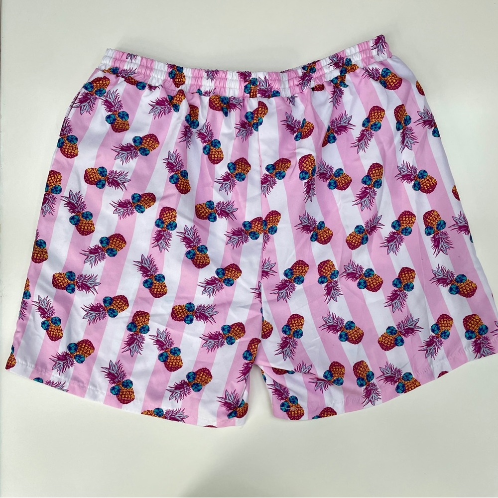 Pink stripe party pineapple swim trunks
